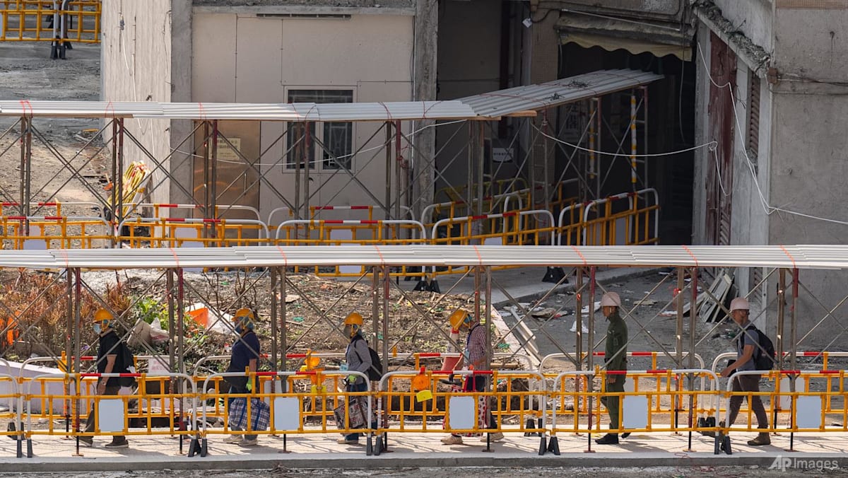 Hong Kong Residents Revisit Charred Apartments Following Catastrophic Blaze