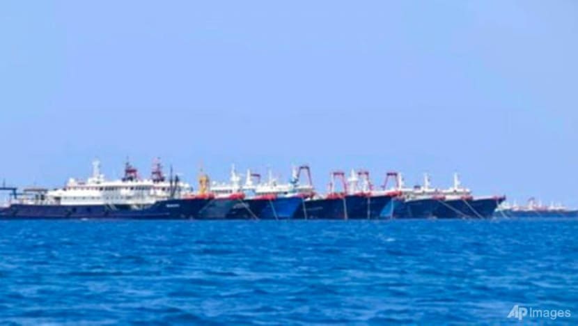 China denies incursion as more than 200 ships dock at Philippine reef