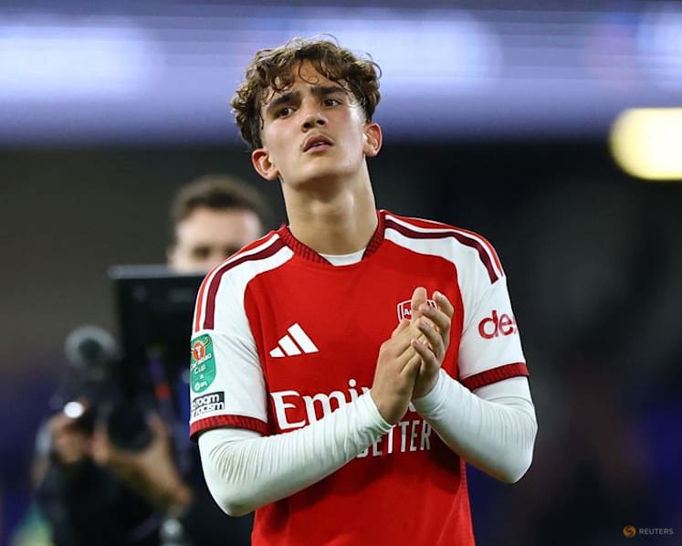 Teenager Dowman scores twice as Arsenal progress in League Cup