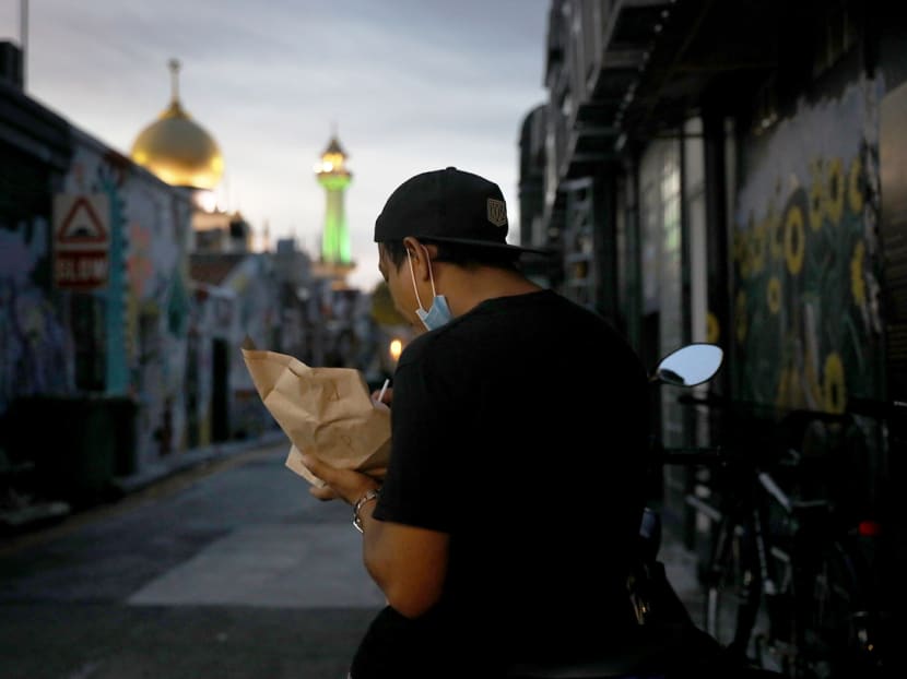 A food delivery rider breaking fast near Jalan Sultan on May 13, 2020.