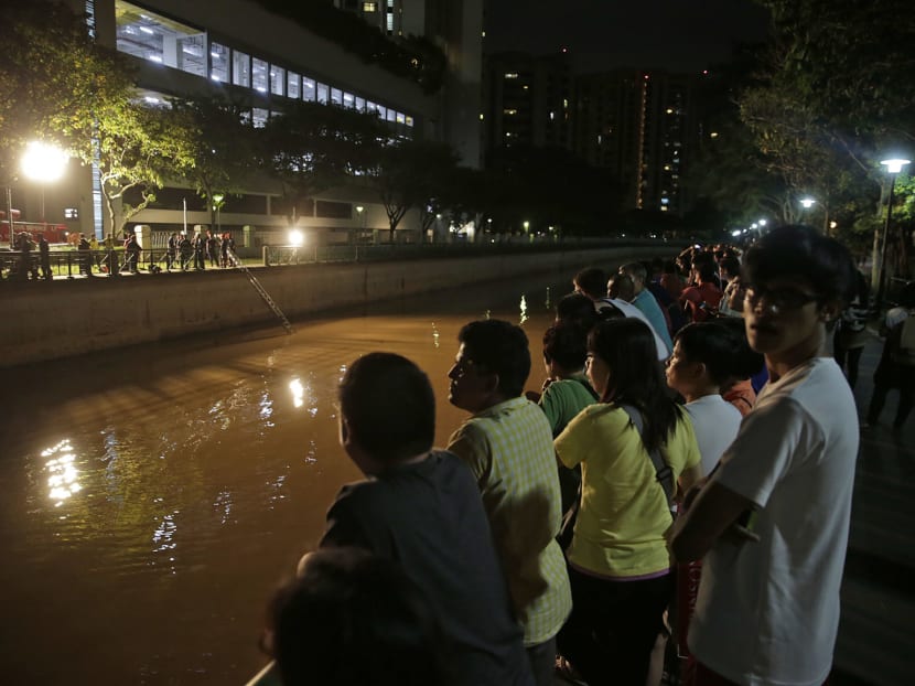 2 women killed after car plunges into Singapore River