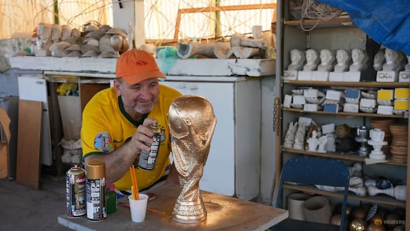 In Rio, artisan crafts World Cup trophies while hoping Brazil gets a real one