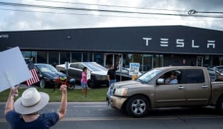Tesla tiptoes into long-promised robotaxi service