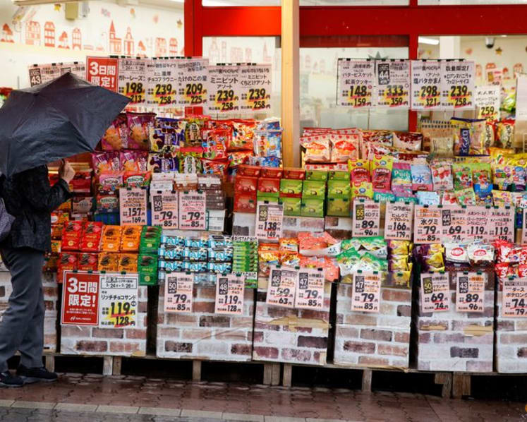 Japan's wholesale prices rise more than expected on sticky food inflation