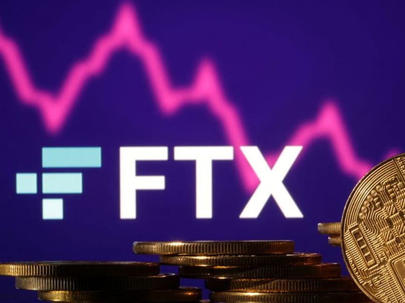FILE PHOTO: Representations of cryptocurrencies are seen in front of displayed FTX logo and decreasing stock graph in this illustration taken November 10, 2022. REUTERS/Dado Ruvic/Illustration FILE PHOTO: Representations of cryptocurrencies are seen in front of displayed FTX logo and decreasing stock graph in this illustration taken November 10, 2022. REUTERS/Dado Ruvic/Illustration