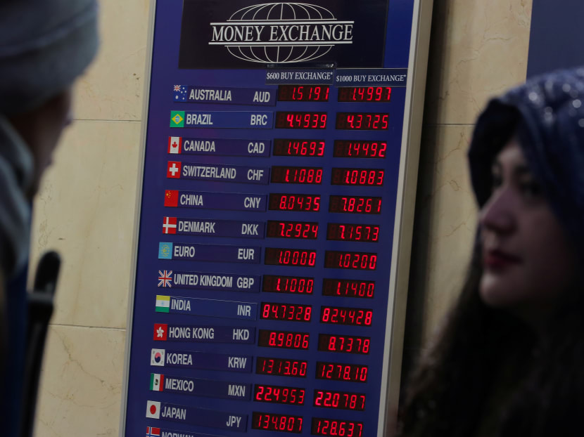 Currency exchange rates are displayed on a board at a Money Exchange kiosk in New York City, US, November 15, 2018.