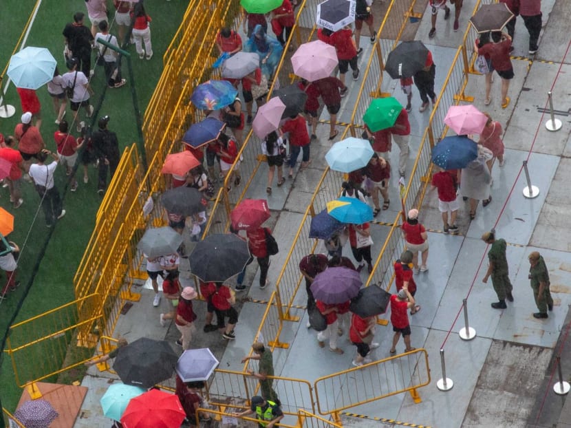 Crowds queueing to attend to the National Day Parade on Aug 9, 2024.