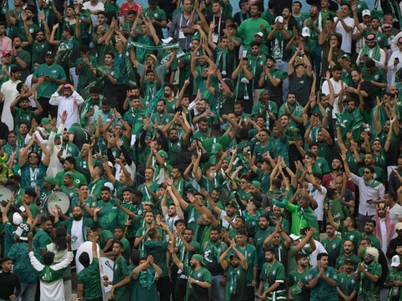 Saudi Arabia supporters celebrate their victory in the Qatar 2022 World Cup Group C football match between Argentina and Saudi Arabia at the Lusail Stadium in Lusail, north of Doha on Nov 22, 2022.