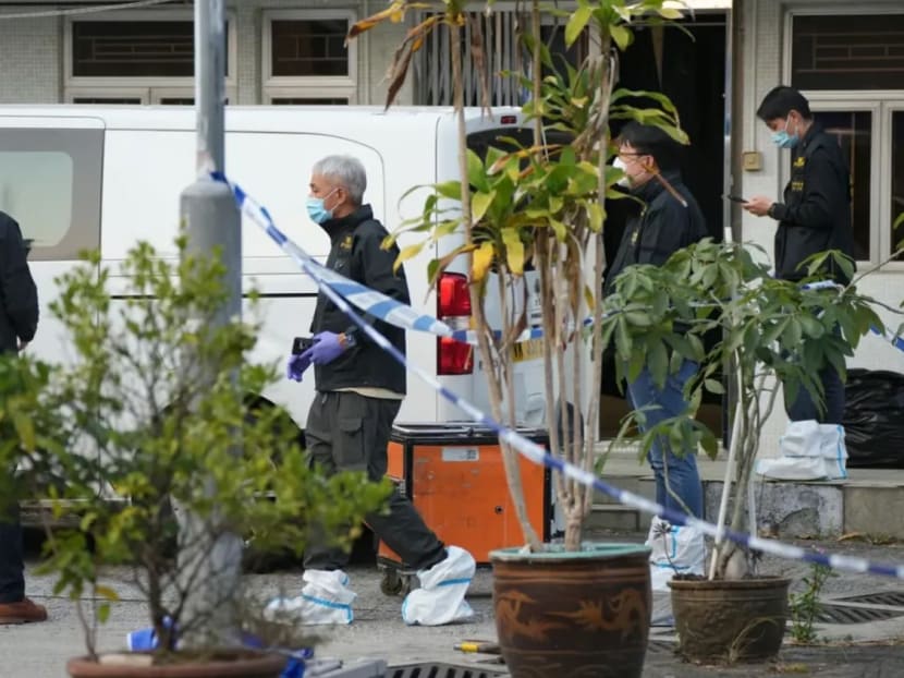 Police officers at the crime scene in Lung Mei Tsuen.