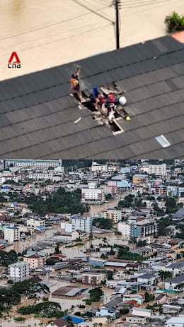 Hat Yai flood: Thai family smashes through roof to escape ravaging waters