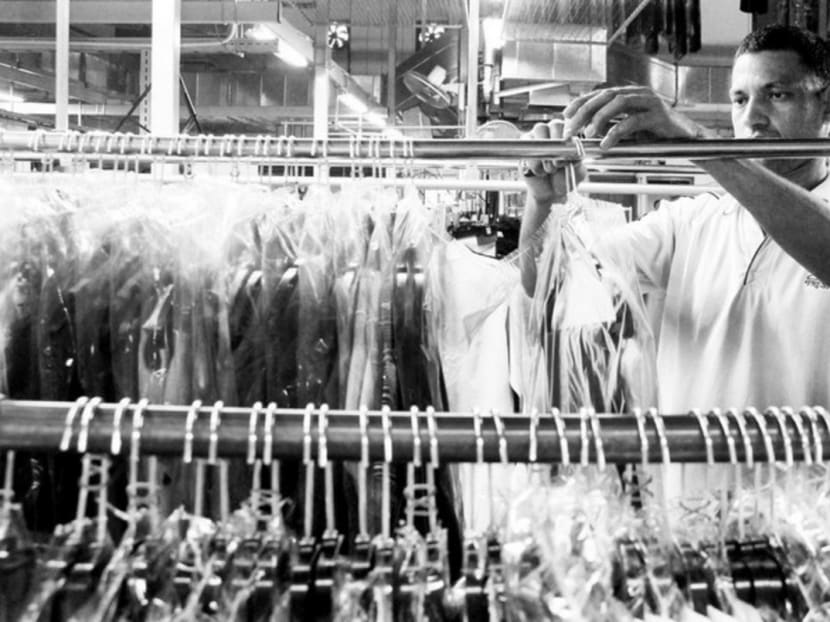 A worker at a production plant of Presto Drycleaners, a local SME. The extension of wage co-funding via the Wage Credit Scheme will help SMEs make themselves more attractive employers. TODAY File Photo