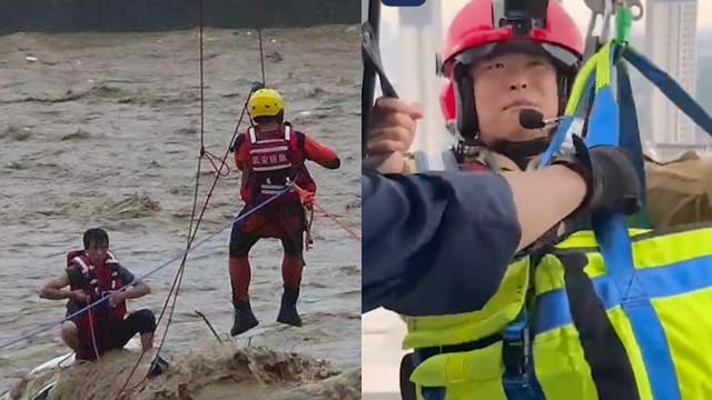 河北连日暴雨酿洪灾 消防员飞索营救受困男