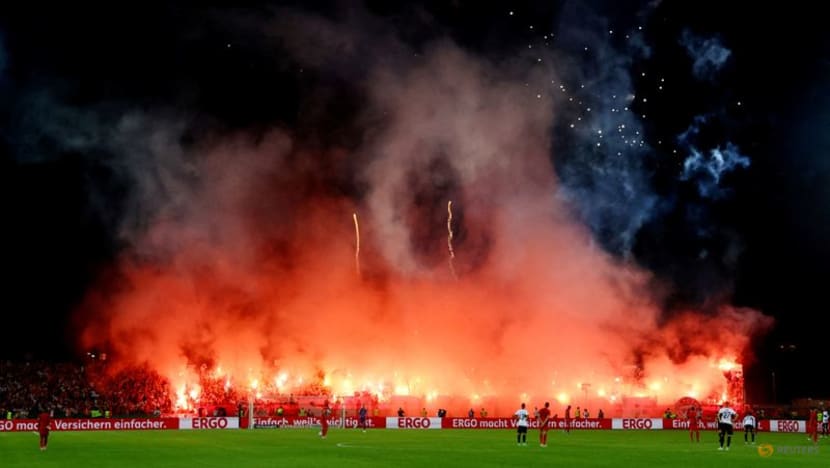 Bayern fined 150,000 euros after fans disrupt Cup game with flares, fireworks Bayern fined 150,000 euros after fans disrupt Cup game with flares, fireworks