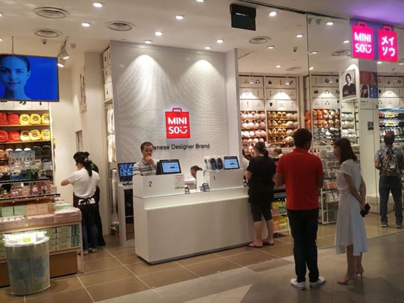 People shopping at a Miniso outlet in Singapore. Miniso has often been accused of copying several Japanese brands.