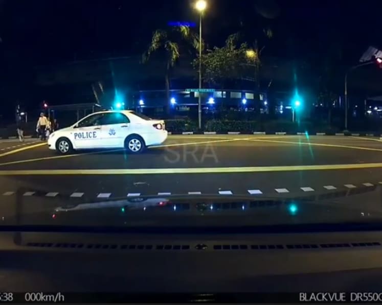 Police officer fined S$200, 12 demerit points for beating red light