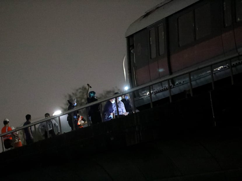 Police officers seen along the train tracks between Kallang and Lavender MRT stations on Feb 25, 2021.