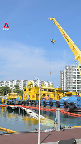 Operation underway to remove yacht destroyed by fire at Sentosa Cove