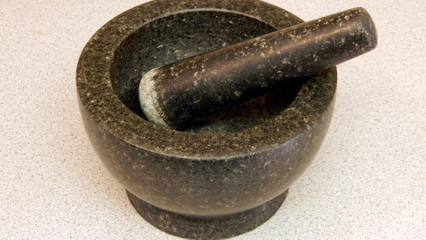 Jail for worker who hit dorm mate with stone pestle for insulting dead mother