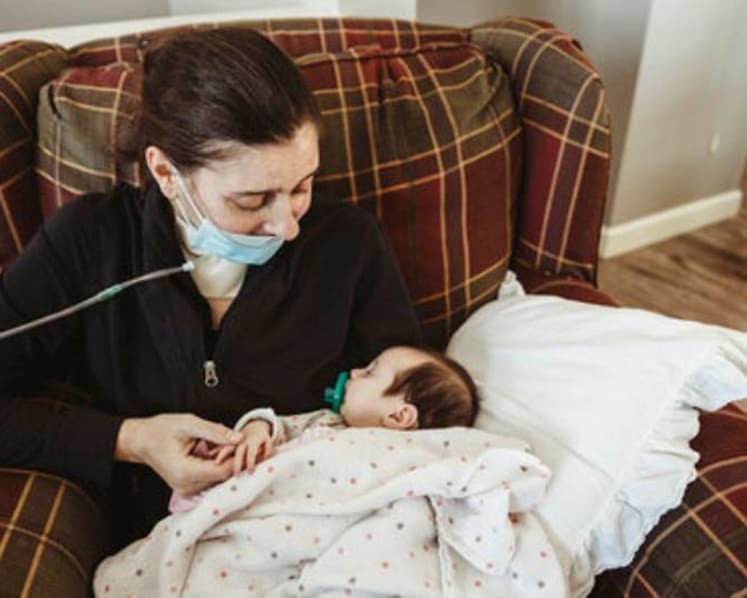 US mother meets baby delivered during COVID-19 coma