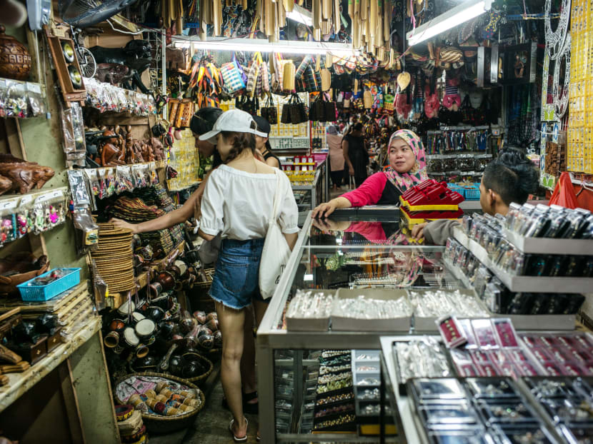 Shoppers browse handicrafts at the Filipino Market in Kota Kinabalu, Sabah.