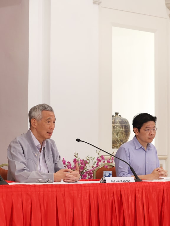 Prime Minister Lee Hsien Loong (centre) held a press conference together with former minister Khaw Boon Wan (left) and Finance Minister Lawrence Wong on April 16, 2022 Prime Minister Lee Hsien Loong (centre) held a press conference together with former minister Khaw Boon Wan (left) and Finance Minister Lawrence Wong on April 16, 2022