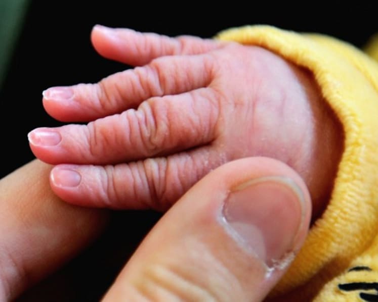 Open verdict on death of 3-week-old boy who fell asleep in arms of confinement nanny