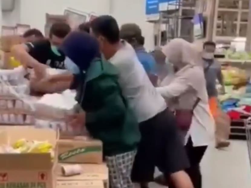 Shoppers captured in a viral social media video shoving others to get their hands on a carton of Nestle's Bear Brand sterilised milk in Tangerang, Indonesia, after rumours surfaced that it could kill the coronavirus. Shoppers captured in a viral social media video shoving others to get their hands on a carton of Nestle's Bear Brand sterilised milk in Tangerang, Indonesia, after rumours surfaced that it could kill the coronavirus.