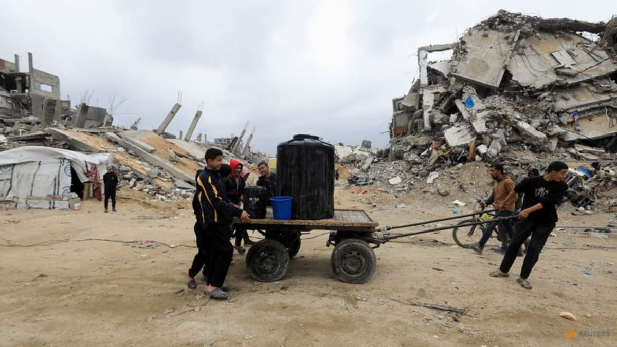 Hamas names hostages to be freed after accusing Israel of breaching ceasefire
