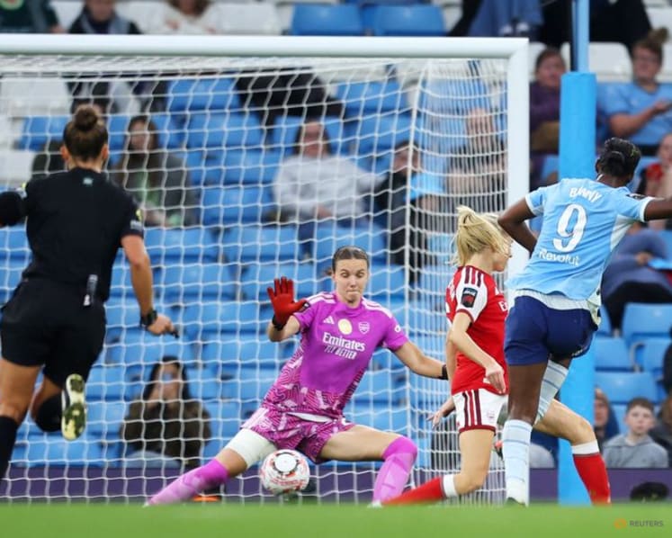 Manchester City beat hapless Arsenal 4-2 to stay top of WSL