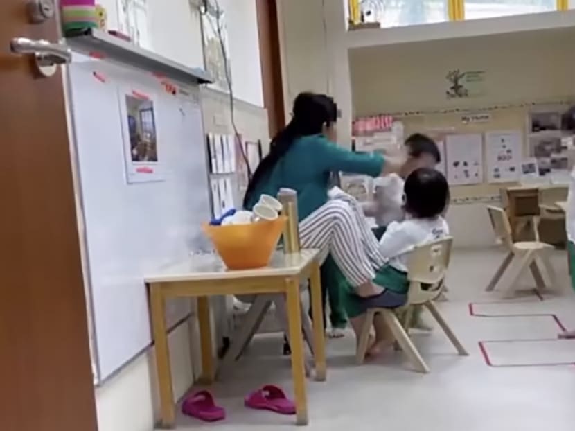 A screengrab from a video showing a teacher hitting the head of a child purportedly at a Kinderland preschool at Sunshine Place in Choa Chu Kang. A screengrab from a video showing a teacher hitting the head of a child purportedly at a Kinderland preschool at Sunshine Place in Choa Chu Kang.