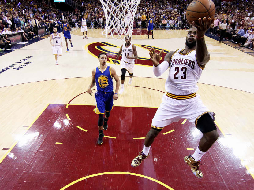 LeBron James of the Cleveland Cavaliers goes up against Stephen Curry of the Golden State Warriors. Photo: Getty Images