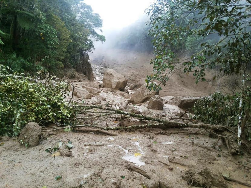 The mudslides in Sabah. Non-stop rain since Saturday has caused boulders, mud, tree logs and other debris to flow down a river, trapping villagers in their homes. Photo: Twitter