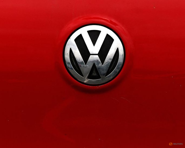 Volkswagen profit plunges as carmaker weighs mass job cuts
