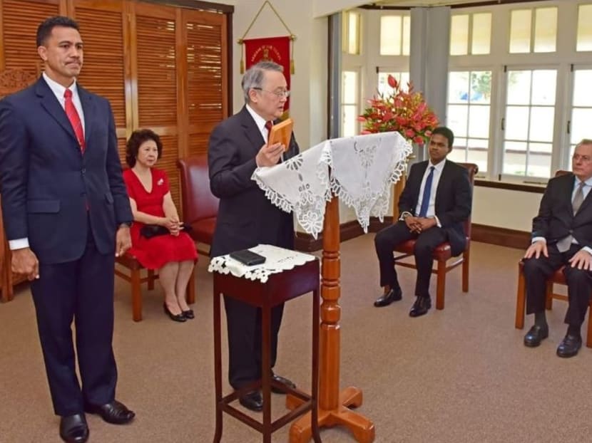 Justice Quentin Loh taking the oath of office.