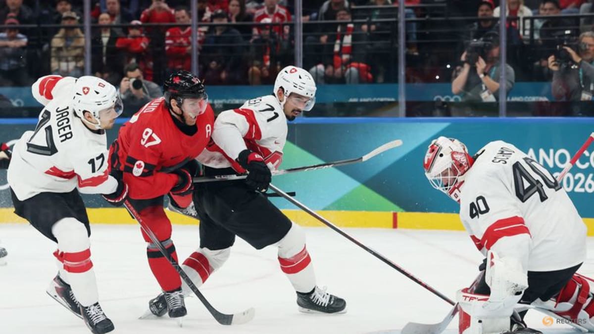 Ice hockey-Canada ease past Swiss, Finland beat Sweden, Slovakia, Czechs notch wins