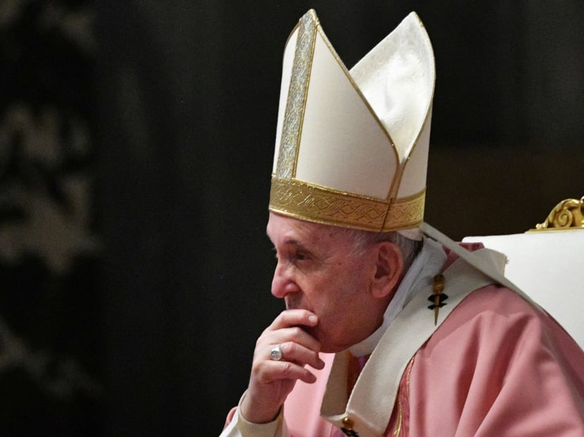 Pope Francis listens to Philippine Cardinal Luis Antonio Tagle (not pictured) during a mass to mark 500 years of Christianity in the Philippines, in St. Peter's Basilica at the Vatican on March 14, 2021.