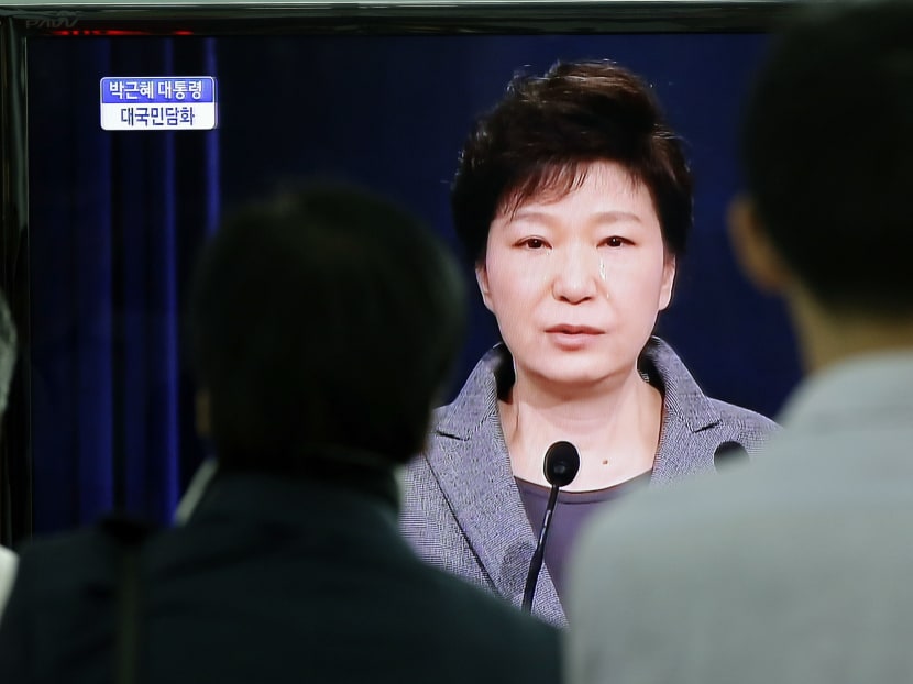 People watch a TV live program showing South Korean President Park Geun-hye's televised speech to the nation about the sunken ferry Sewol at the Seoul Train Station in Seoul, South Korea, on May 19, 2014. Photo: AP