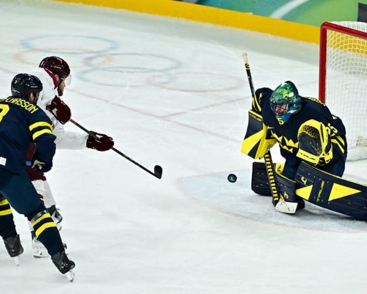 Ice hockey-Sweden beat Latvia to set men's quarter-final meeting with US