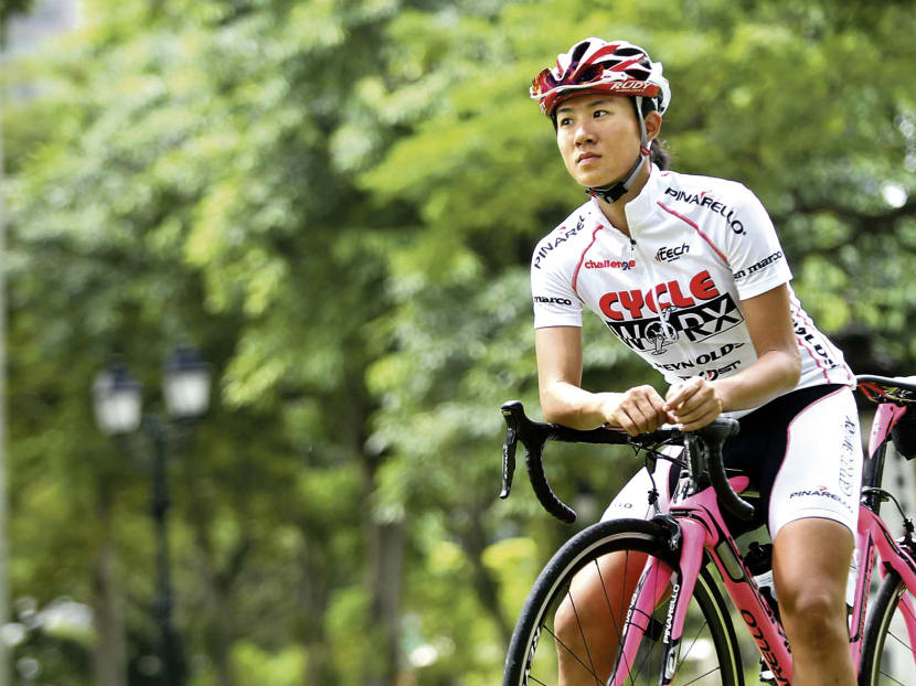 OCBC Cycle Singapore Pro Cycling Team members Low Ji Wen (left) and Tavis Woodford (right) at Yu Neng Primary School to conduct a safe cycling clinic for its 830 students this afternoon (Feb 12). Photo: Ernest Chua