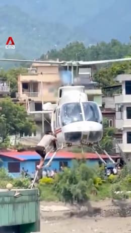 Helicopter rescues man stranded by Nepal floods