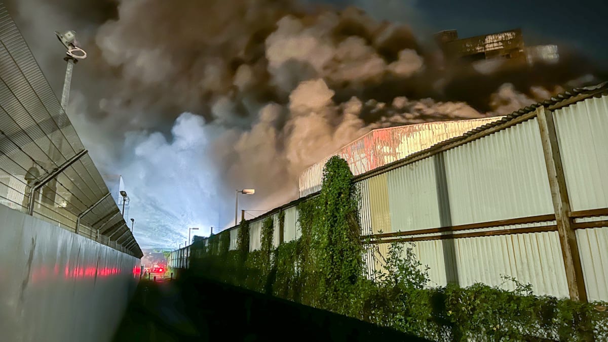 Fire size of 1.5 football fields breaks out at Tuas South industrial ...
