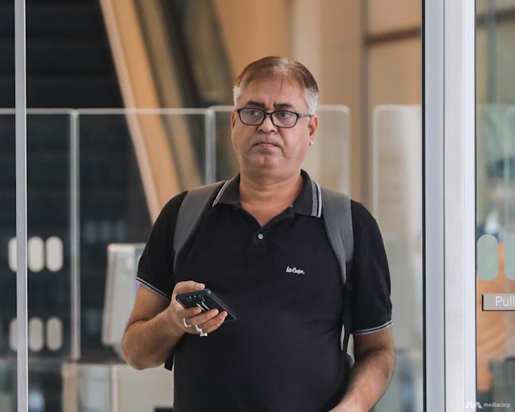 Retiree scammed of S$64,000 after computer was 'taken over', man who received the money on trial