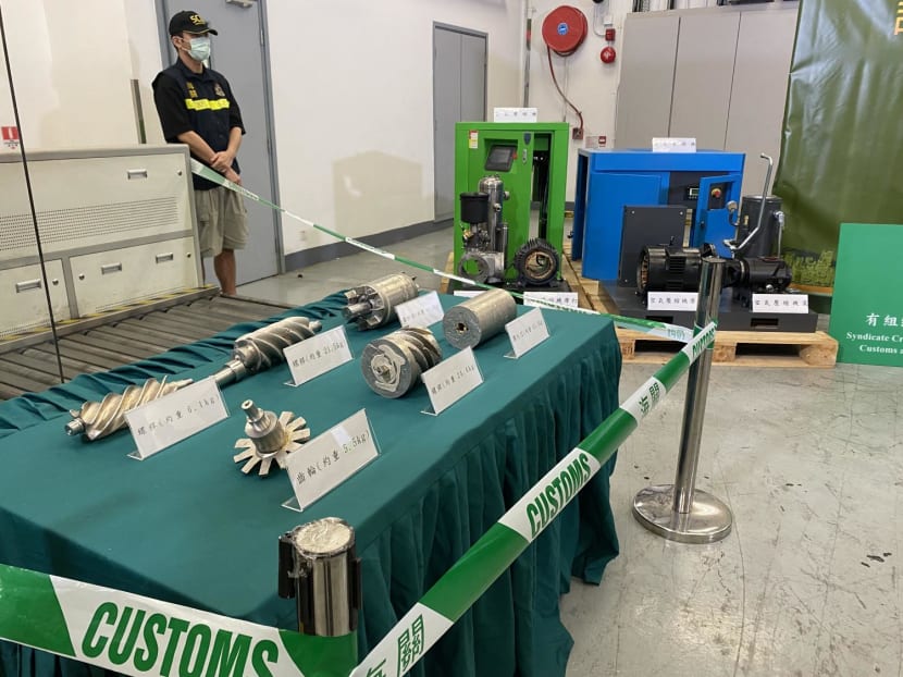Hong Kong customs officers display smuggled gold after seizing 146kg of the precious metal disguised as air compressor parts at the city's international airport in Hong Kong on April 8, 2024. Hong Kong customs officers display smuggled gold after seizing 146kg of the precious metal disguised as air compressor parts at the city's international airport in Hong Kong on April 8, 2024.