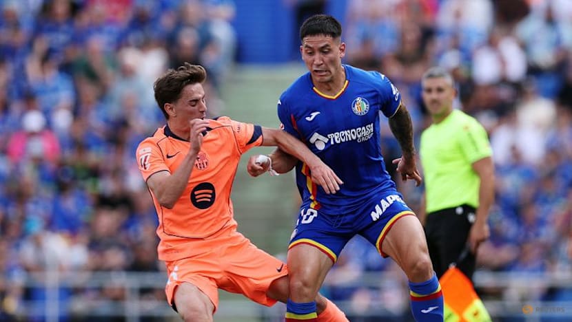 Barcelona march on towards title with 2-0 victory at Getafe