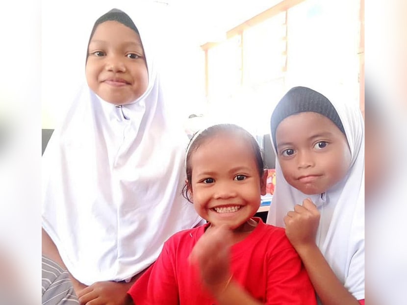Aishah (centre) with some of her schoolmates.