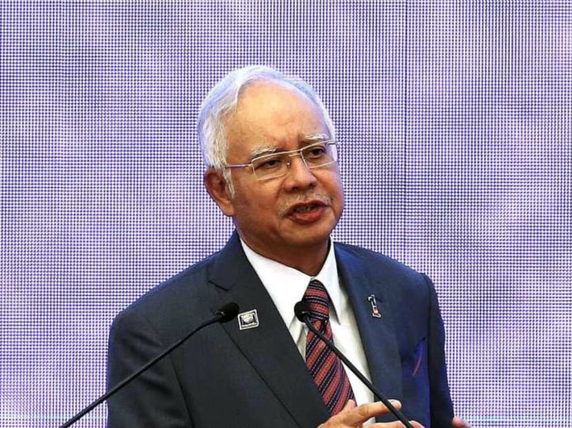 Malaysian Prime Minister Najib Razak said that the country faces an "uphill battle" to become a developed nation in the next five years. Photo: Reuters