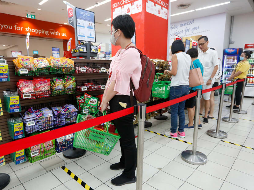 Safe distancing measures seen at the NTUC FairPrice outlet in Nex shopping mall on March 20, 2020.