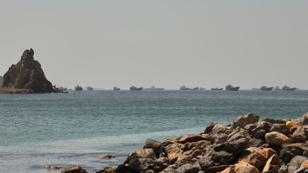 Singapore-registered ship hit by projectile in Strait of Hormuz, crew members safe