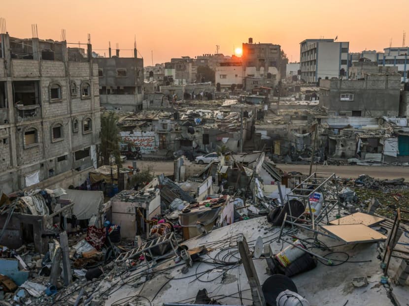 The sun rises above the Rafah refugee camp in the southern Gaza Strip on Jan 1, 2024, amid the ongoing conflict between Israel and the Palestinian militant group Hamas.