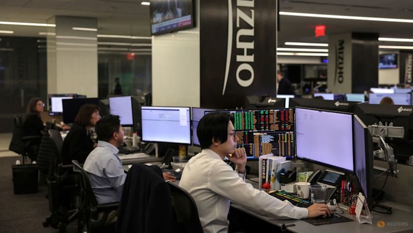 Japan's megabanks lift profit forecasts to record highs, step up buybacks